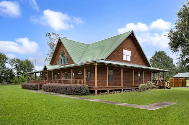 back of property featuring a porch and a yard