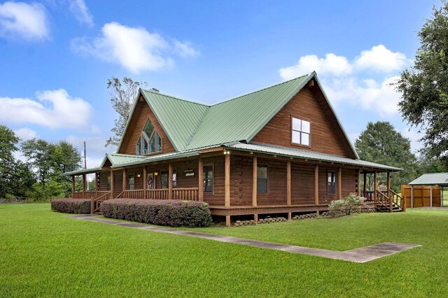 back of property featuring a porch and a yard