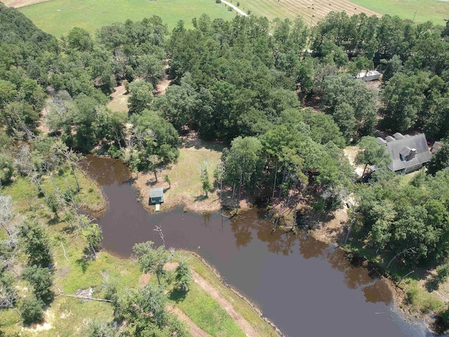 drone / aerial view featuring a water view and a rural view