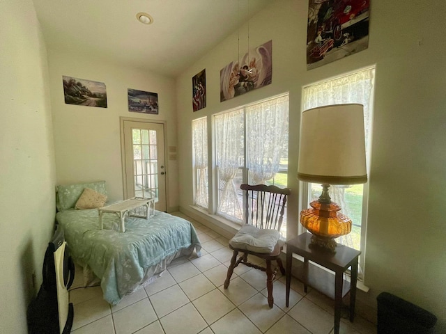 bedroom featuring light tile patterned floors