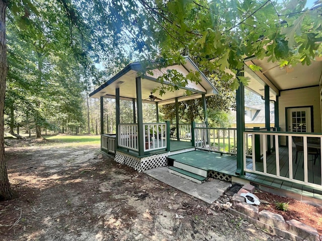 exterior space featuring ceiling fan