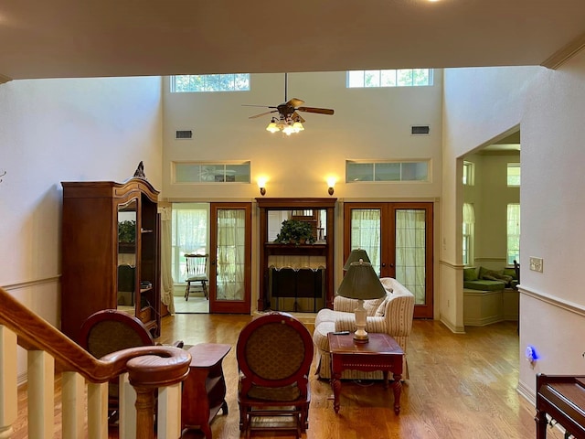 living room featuring plenty of natural light and french doors