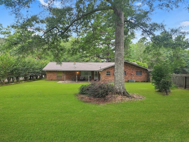 906 Richardson Dr, Jasper, TX 75951 - back of house featuring a patio area and brick siding