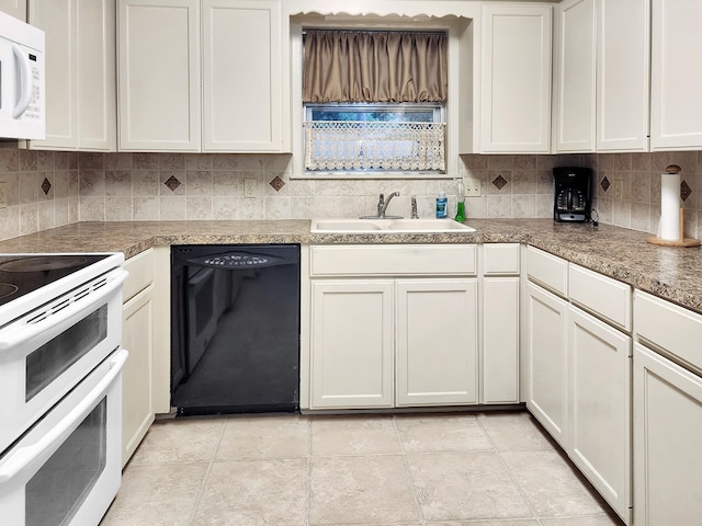 906 Richardson Dr, Jasper, TX 75951 - kitchen featuring white appliances, decorative backsplash, and white cabinets