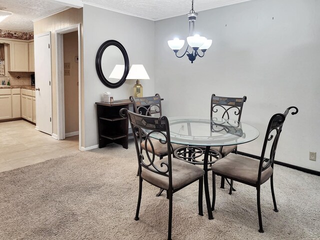906 Richardson Dr, Jasper, TX 75951 - dining area with a textured ceiling, a chandelier, ornamental molding, and light colored carpet
