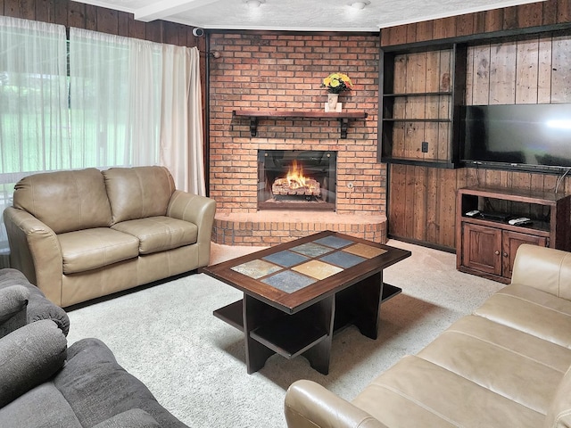 906 Richardson Dr, Jasper, TX 75951 - carpeted living room featuring a brick fireplace and wood walls