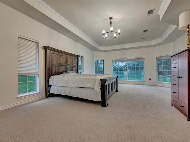 carpeted bedroom with a raised ceiling, a chandelier, and ornamental molding