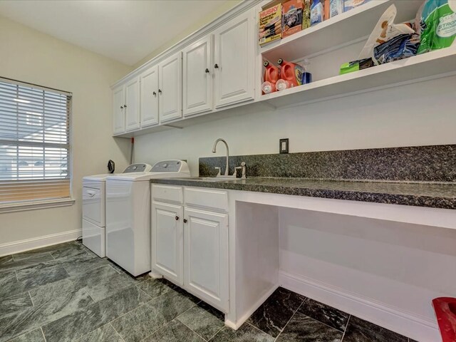 laundry area with cabinets, sink, and washing machine and clothes dryer