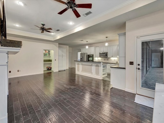 living room with ceiling fan, dark hardwood / wood-style flooring, and ornamental molding