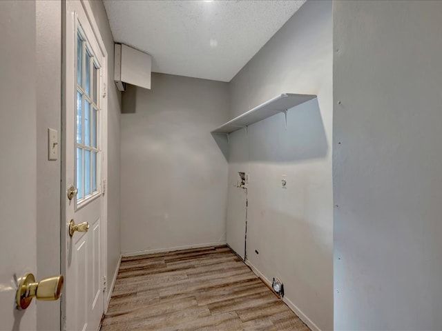 laundry room with baseboards, hookup for an electric dryer, laundry area, light wood-style flooring, and washer hookup