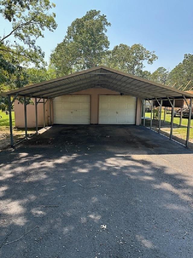 garage with a carport