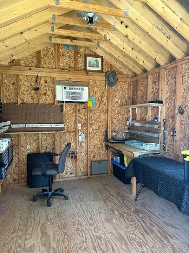 storage room with a wall mounted air conditioner