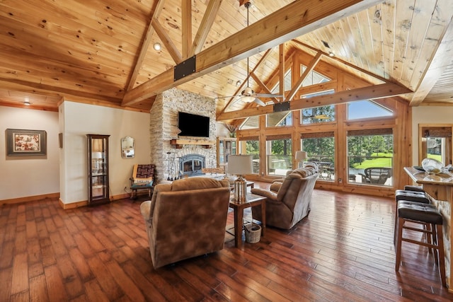 225 Mcgregor Dr, Brookeland, TX 75931 - living area with wooden ceiling, beamed ceiling, baseboards, and a stone fireplace