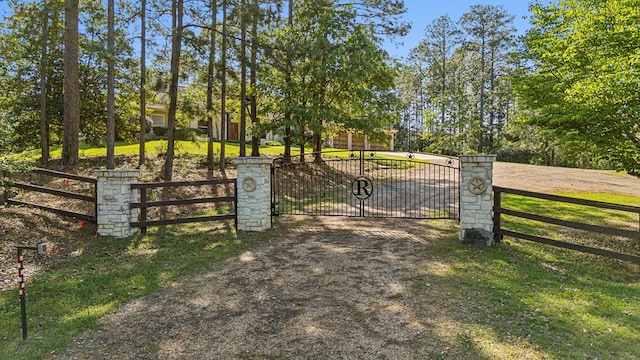 225 Mcgregor Dr, Brookeland, TX 75931 - view of gate featuring a yard and fence