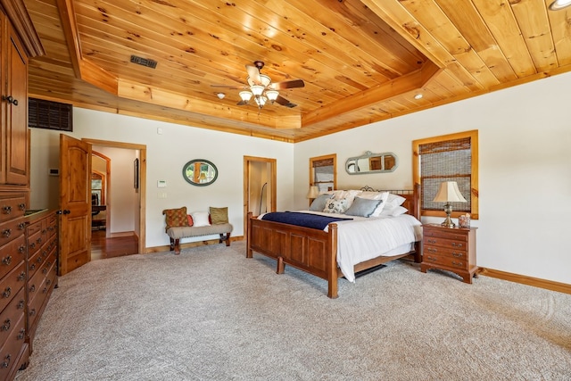 225 Mcgregor Dr, Brookeland, TX 75931 - bedroom featuring light carpet, a raised ceiling, wood ceiling, and baseboards