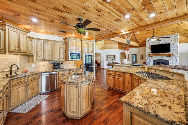 225 Mcgregor Dr, Brookeland, TX 75931 - kitchen with a ceiling fan, wood ceiling, a sink, open floor plan, and appliances with stainless steel finishes