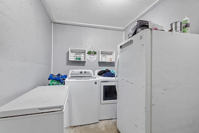 laundry area with independent washer and dryer