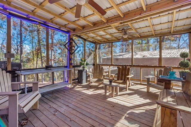 sunroom featuring ceiling fan