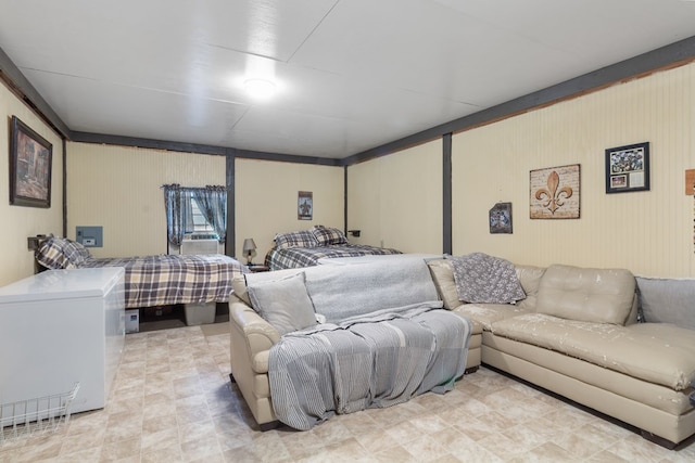 bedroom with refrigerator