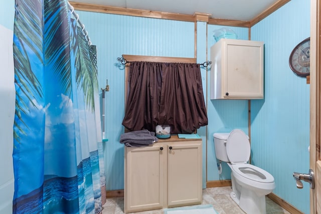 bathroom featuring toilet and crown molding