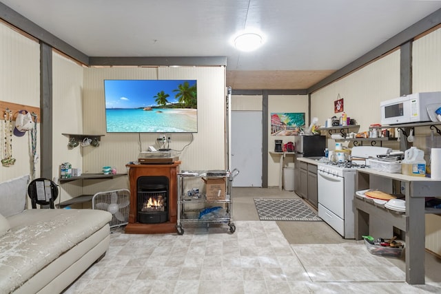 kitchen featuring white appliances and a wood stove