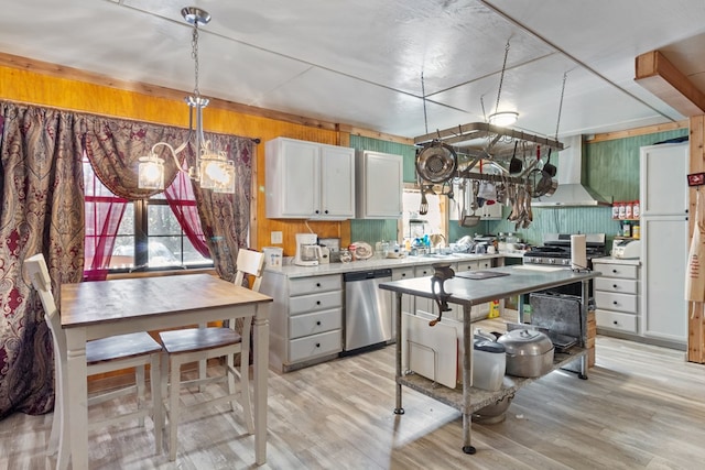 kitchen with decorative light fixtures, stainless steel dishwasher, light wood-type flooring, and ventilation hood