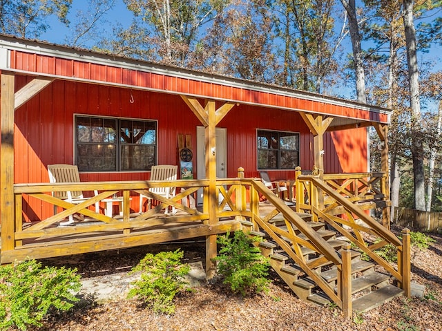 wooden terrace with a porch