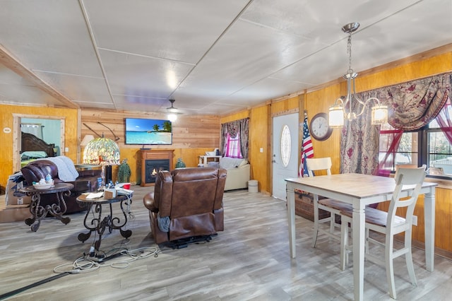 living room with wood-type flooring and wood walls