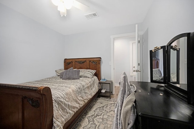 bedroom with french doors, hardwood / wood-style flooring, and ceiling fan