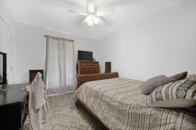 bedroom featuring ceiling fan and hardwood / wood-style floors