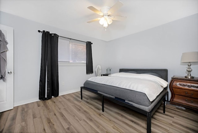 bedroom featuring ceiling fan and light hardwood / wood-style flooring