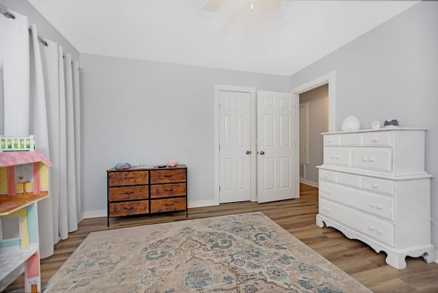 bedroom featuring ceiling fan and light hardwood / wood-style flooring