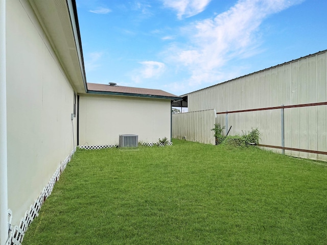 view of yard with central AC