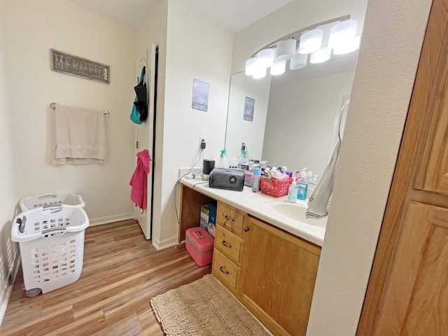 bathroom featuring hardwood / wood-style floors and vanity