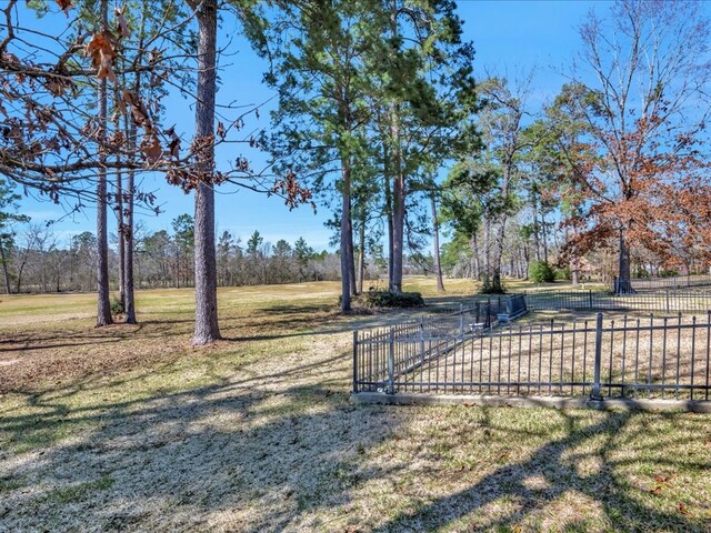 view of yard with a gate and fence