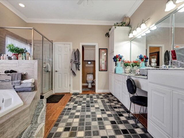 full bath with wood finished floors, a garden tub, crown molding, vanity, and a shower stall