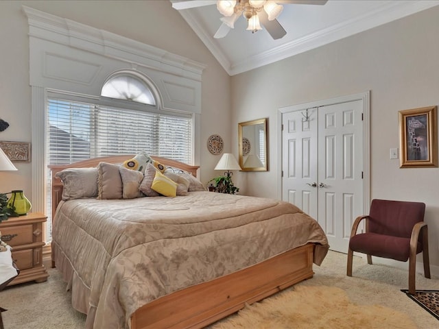 bedroom with light carpet, ornamental molding, a closet, and a ceiling fan