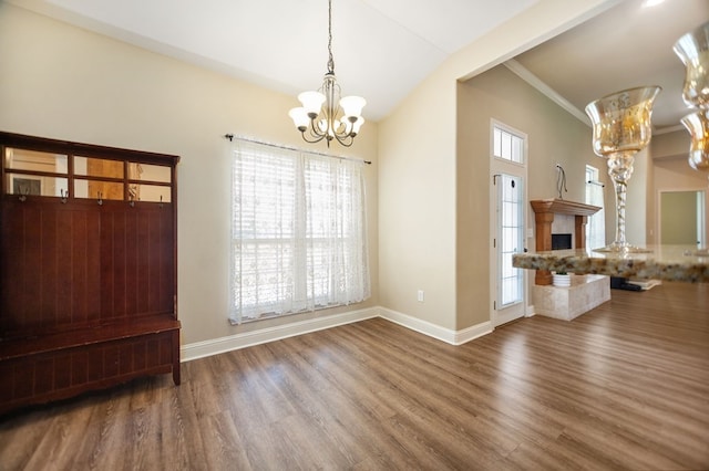 113 Westfield Loop, Lufkin, TX 75904 - unfurnished dining area with a chandelier, wood finished floors, and crown molding