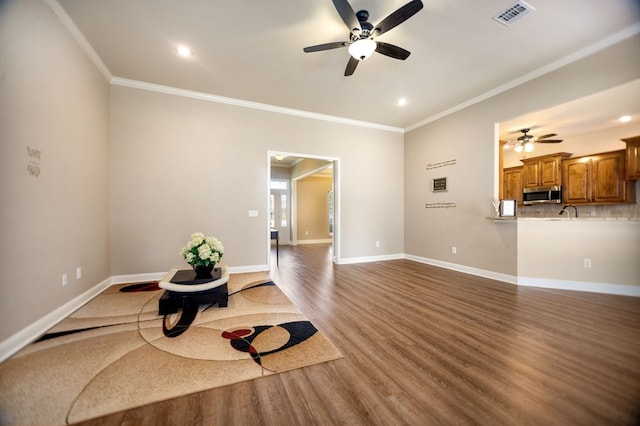 113 Westfield Loop, Lufkin, TX 75904 - exercise room with a ceiling fan, crown molding, wood finished floors, and recessed lighting