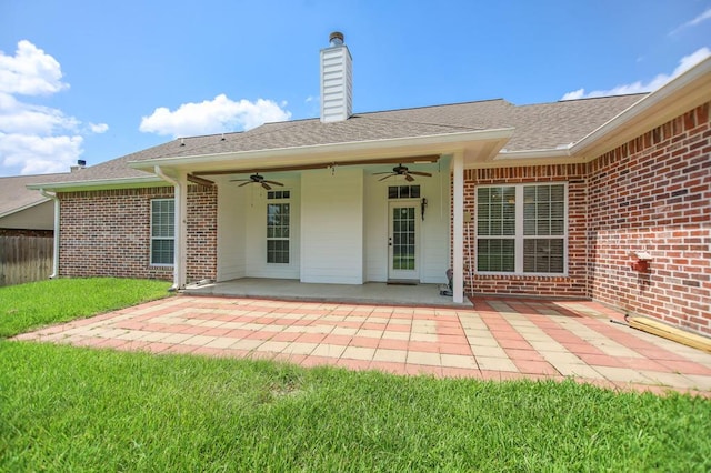 113 Westfield Loop, Lufkin, TX 75904 - back of house featuring ceiling fan, brick siding, a patio, a chimney, and a shingled roof