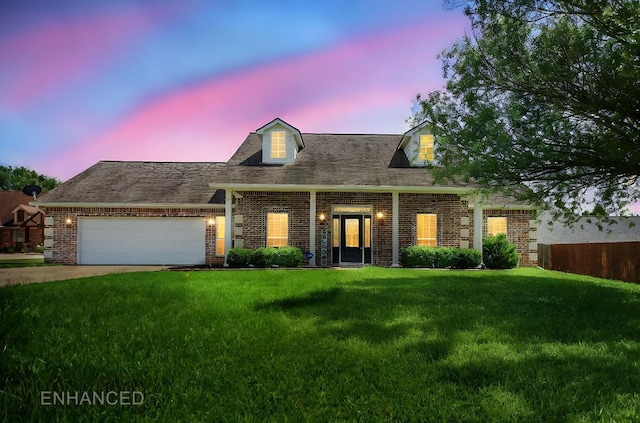 113 Westfield Loop, Lufkin, TX 75904 - new england style home with brick siding, a lawn, and a garage