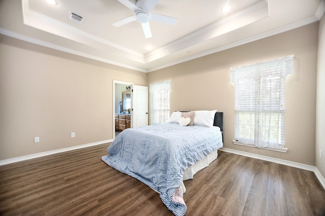 113 Westfield Loop, Lufkin, TX 75904 - bedroom featuring a tray ceiling, wood finished floors, ornamental molding, recessed lighting, and ensuite bath