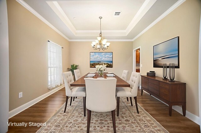 113 Westfield Loop, Lufkin, TX 75904 - dining space with a raised ceiling, wood finished floors, a chandelier, and crown molding