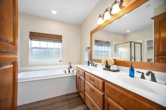 113 Westfield Loop, Lufkin, TX 75904 - bathroom featuring a shower stall, a garden tub, double vanity, and wood finished floors