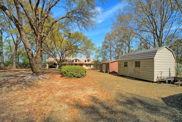 2105 Carters Ferry Rd, E Road, Milam, TX 75959 - view of yard with a storage shed and an outdoor structure