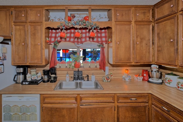 2105 Carters Ferry Rd, E Road, Milam, TX 75959 - kitchen featuring a sink, dishwasher, and brown cabinets