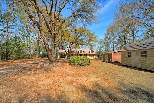 2105 Carters Ferry Rd, E Road, Milam, TX 75959 - view of yard with an outdoor structure