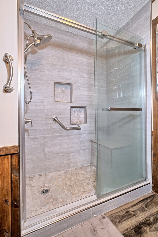 2105 Carters Ferry Rd, E Road, Milam, TX 75959 - bathroom with a stall shower and a textured ceiling