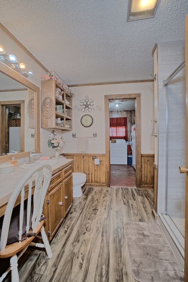 2105 Carters Ferry Rd, E Road, Milam, TX 75959 - full bath with washer / clothes dryer, a shower stall, wainscoting, and a textured ceiling