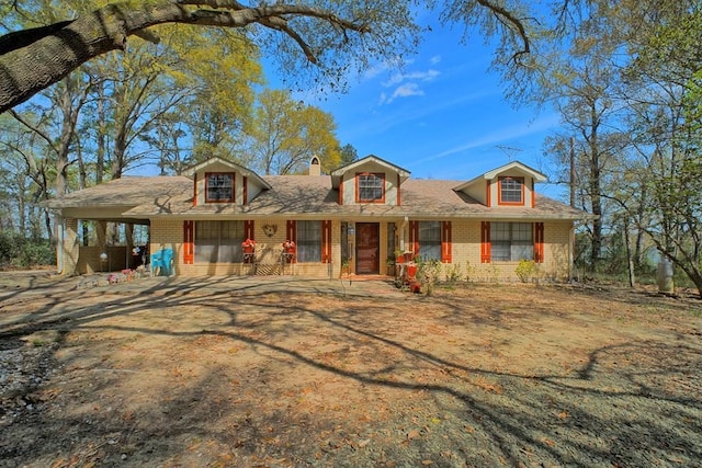 2105 Carters Ferry Rd, E Road, Milam, TX 75959 - view of front of home with a carport, driveway, and brick siding